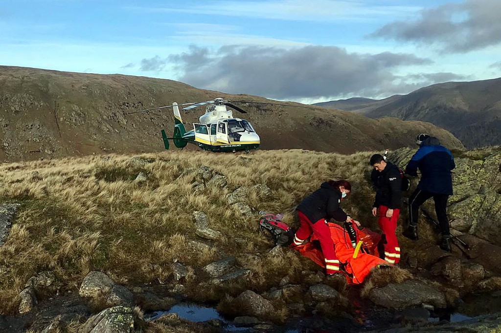 The air ambulance crew treats Mrs Taylor on the summit of Calf Crag. Photo: GNAAS The air ambulance crew treats Mrs Taylor on the summit of Calf Crag. Photo: GNAAS