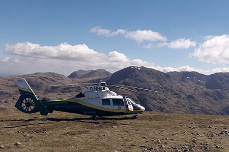 The Pride of Cumbria helicopter on Green Gable during the rescue. Photo: GNAAS The Pride of Cumbria helicopter on Green Gable during the rescue. Photo: GNAAS