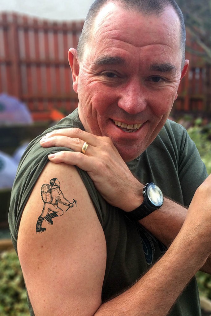 George Fisher director Andy Airey displays his new tattoo