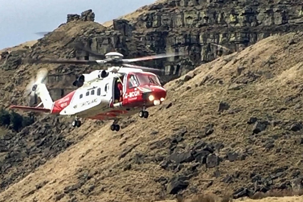 The Coastguard helicopter in action during the Alport Castles rescue. Photo: Glossop MRT