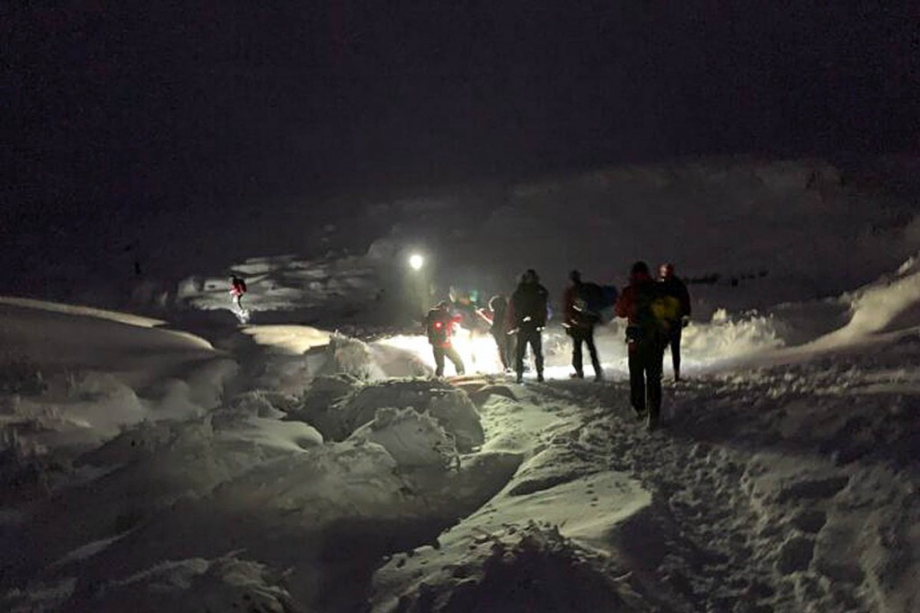 The group was accompanied off the hill by rescuers. Photo: Glossop MRT