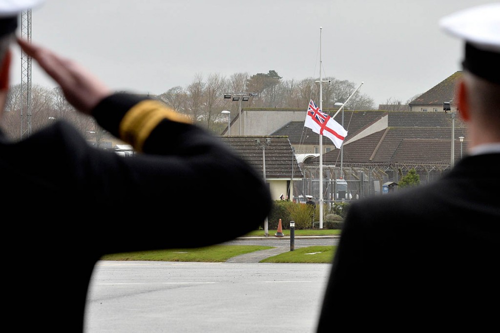 Members of HMS Gannet search and rescue flight salute the White Ensign for the final time Members of HMS Gannet search and rescue flight salute the White Ensign for the final time