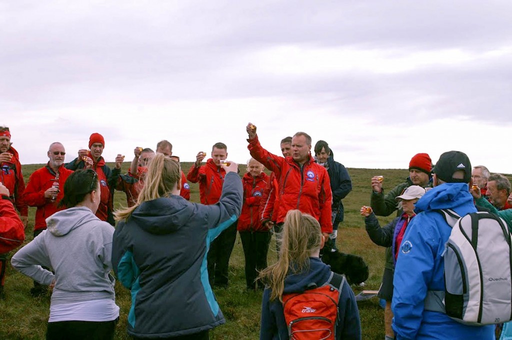 Glasses are raised at the ceremony on Mill Hill. Photo: Chris Haywood Glasses are raised at the ceremony on Mill Hill. Photo: Chris Haywood