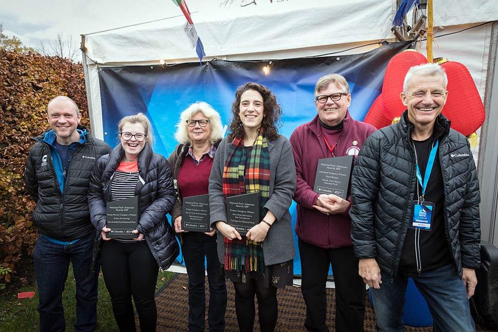 Paul Rose, right, and Lake District National Park Authority chief executive Richard Leafe, left, join award winners at the Kendal Mountain Festival. Photo: Bob Smith/grough