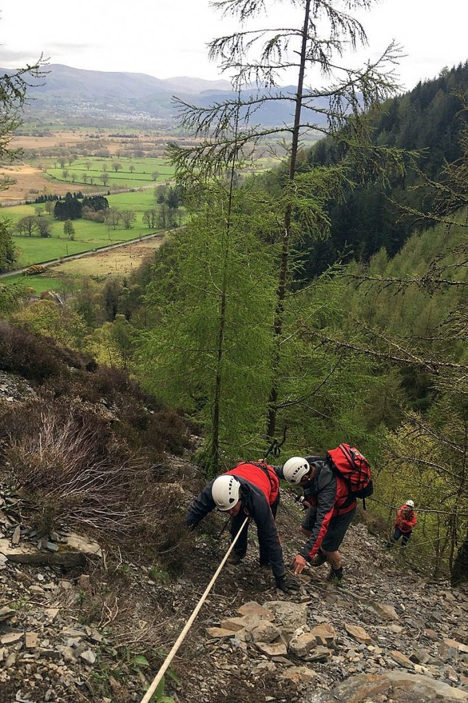 Rescuers used a rope to enable the walker to descend to safer ground. Photo: Keswick MRT