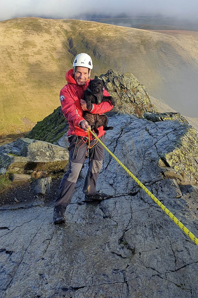 A team member with the rescued dog. Photo: Keswick MRT A team member with the rescued dog. Photo: Keswick MRT