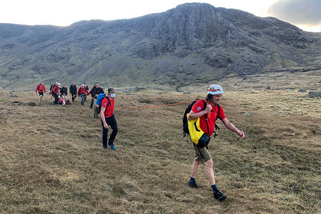 Rescuers stretcher the injured walker from the fells. Photo: Keswick MRT Rescuers stretcher the injured walker from the fells. Photo: Keswick MRT