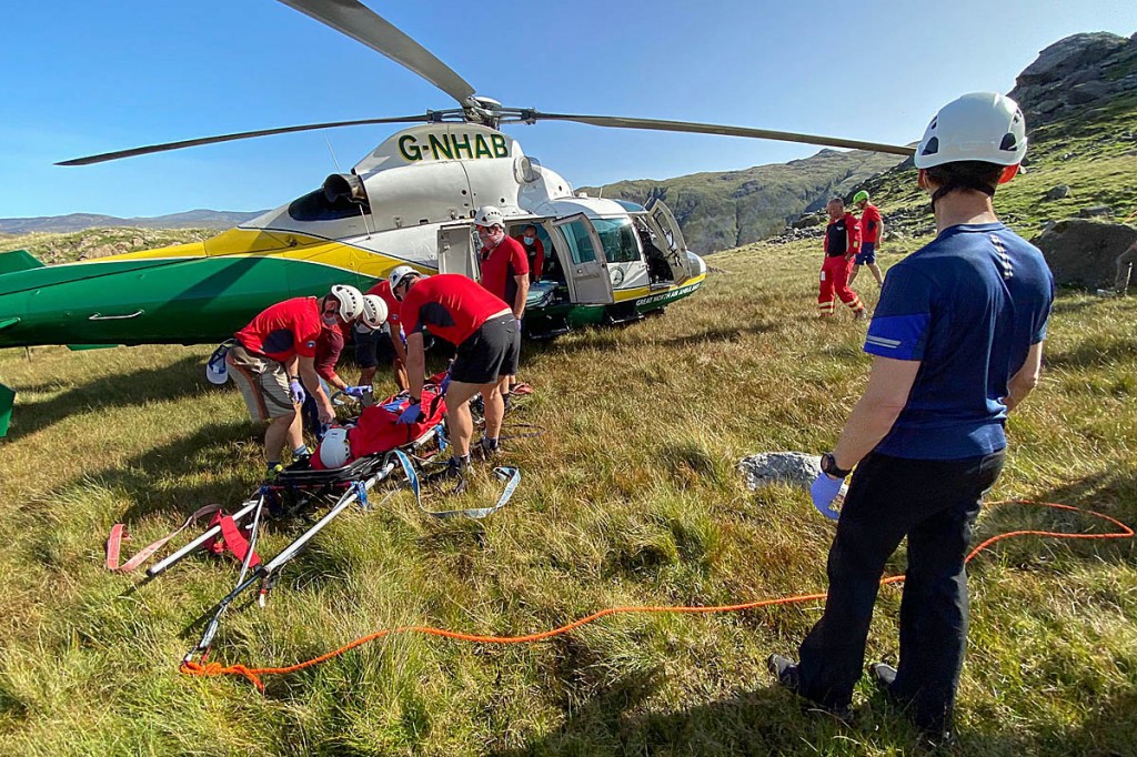 Rescuers with the air ambulance at the scene of the Base Brown incident. Photo: Keswick MRT