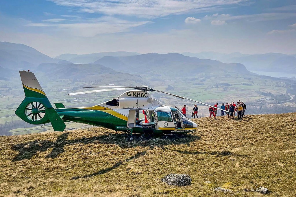 Rescuers approach the air ambulance on Blease Fell. Photo: Keswick MRT