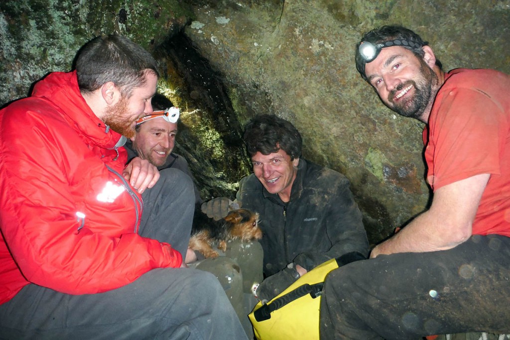 The freed terrier with rescuers. Photo: Keswick MRT