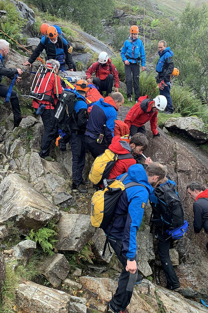 Rescuers manoeuvre the stretcher down the difficult terrain at Sourmilk Gill. Photo: Keswick MRT