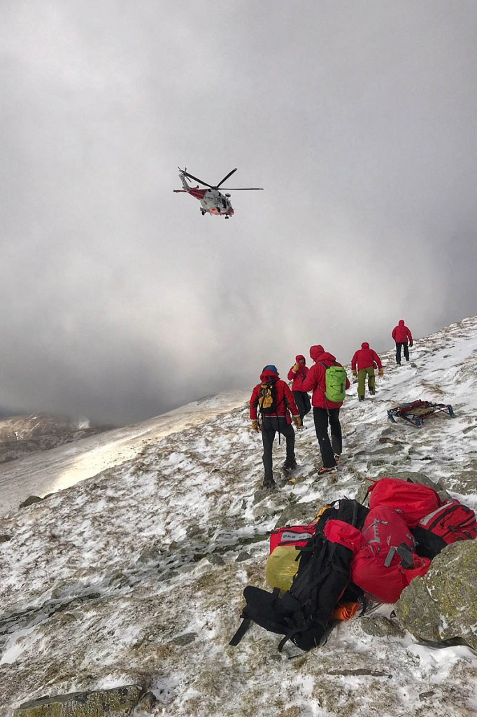 Rescuers and the Coastguard helicopter make their way to the scene of the fatal fall. Photo: Keswick MRT