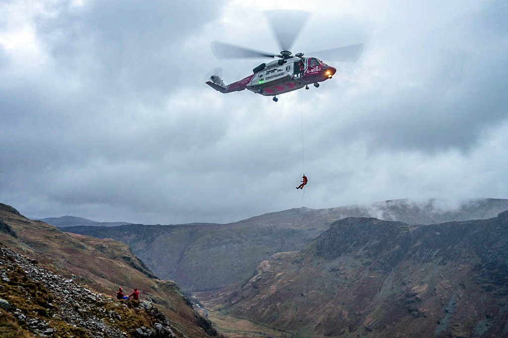 The Coastguard helicopter and rescuers at the scene. Photo: Keswick MRT The Coastguard helicopter and rescuers at the scene. Photo: Keswick MRT