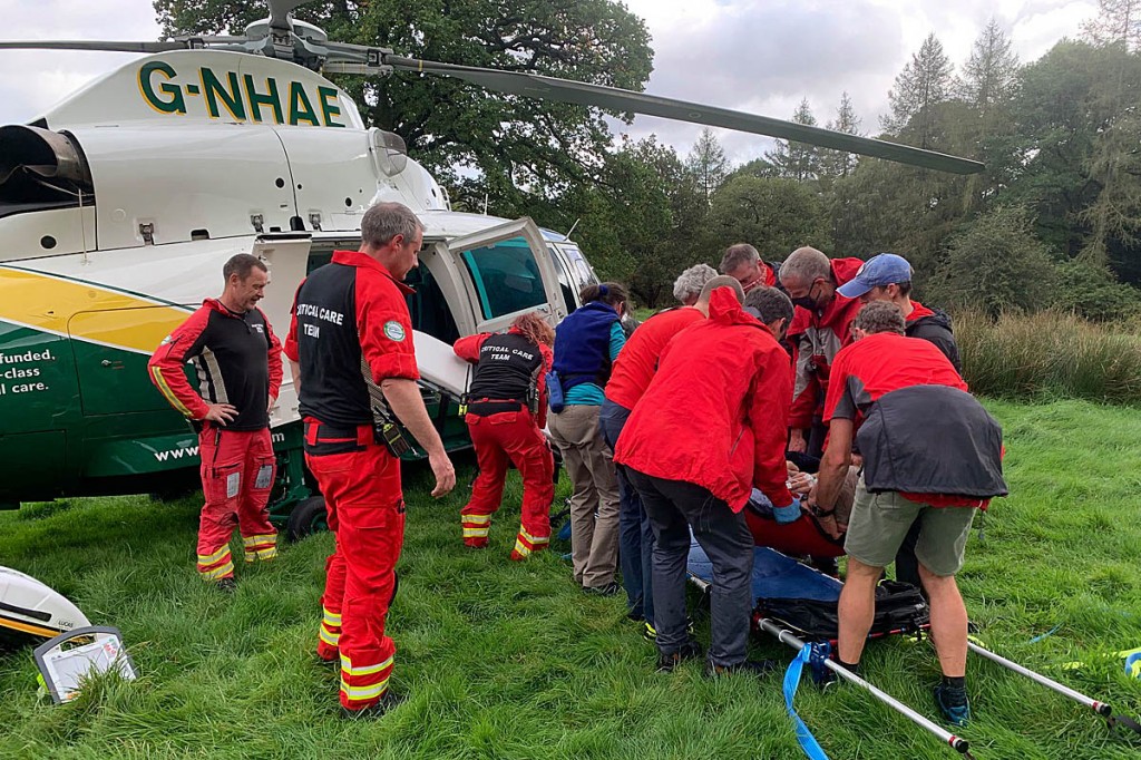 Rescuers prepare to load the walker into the air ambulance. Photo: Keswick MRT