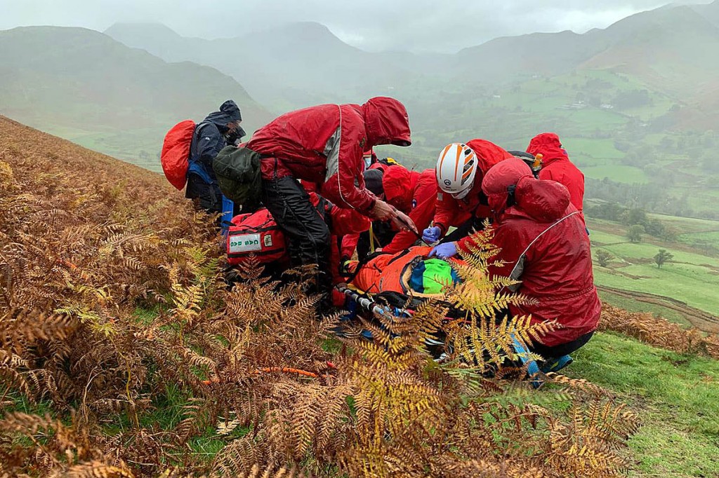 Rescuers with the injured walker on the flanks of Cat Bells. Photo: Keswick MRT
