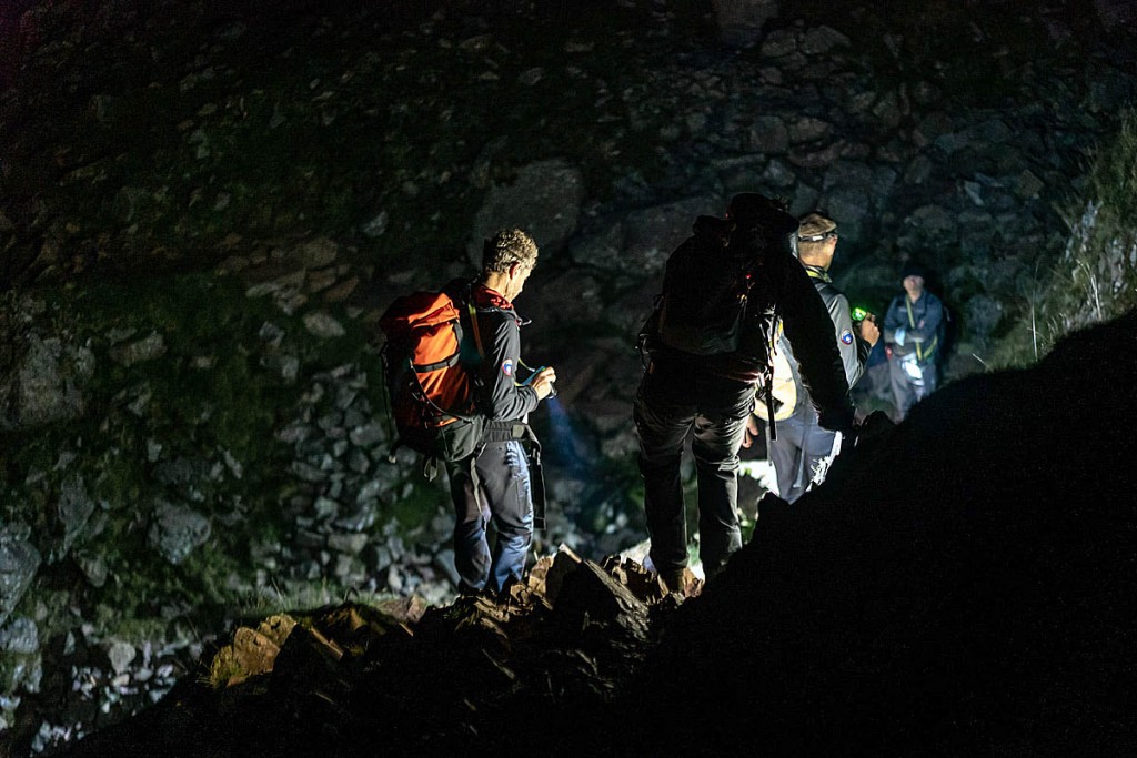 Rescuers accompany the walkers to safety. Photo: Keswick Mountain Rescue Team Rescuers accompany the walkers to safety. Photo: Keswick Mountain Rescue Team