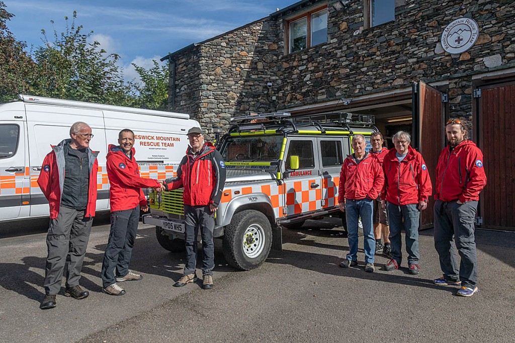 Keswick MRT chairman Gordon Barker thanks Trevor Lawton, Edale's training officer, as the Land Rover is handed over. Photo: Keswick MRT