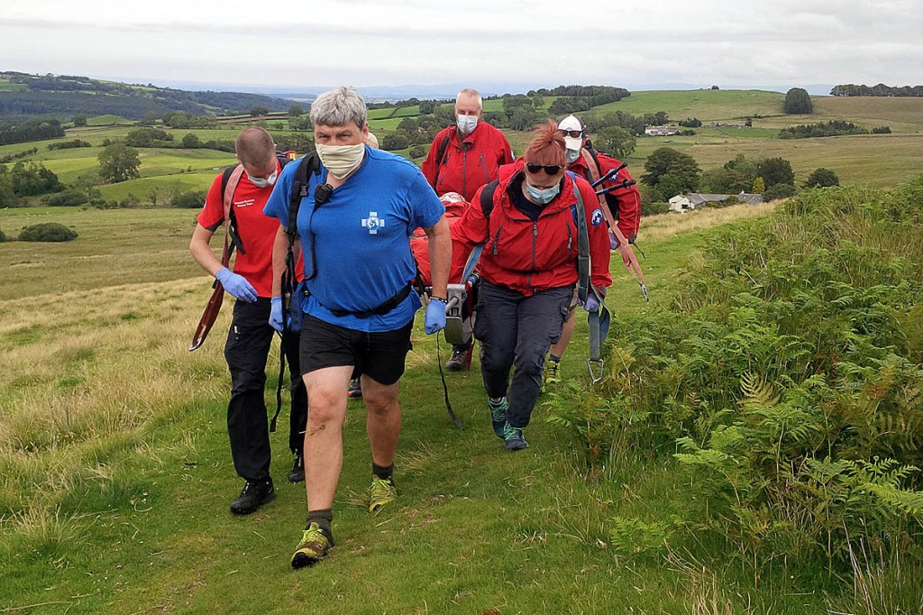 Rescuers stretcher the man from the fell. Photo: Keswick MRT