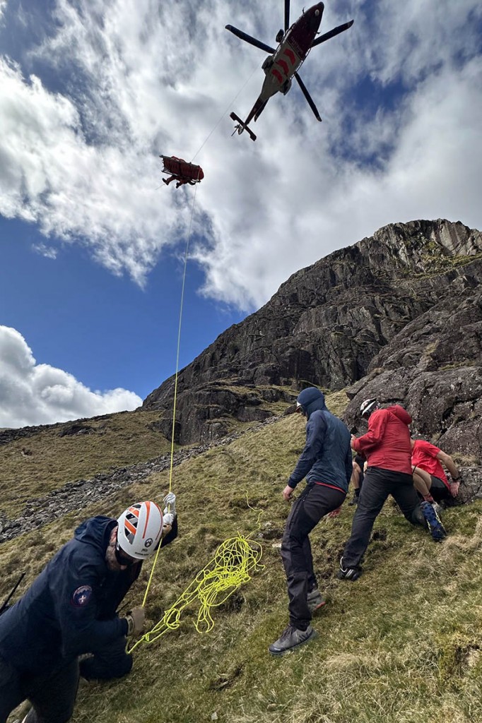 The injured woman is winched into the helicopter. Photo: Keswick MRT