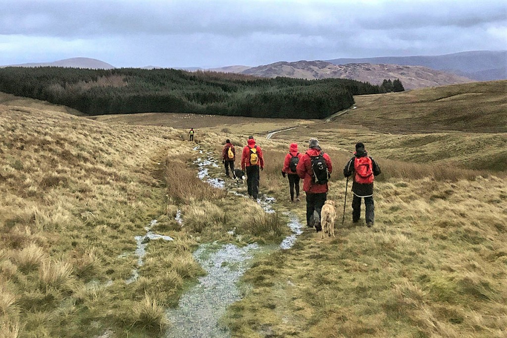 The walkers are led to safety from the Helvellyn range. Photo: Keswick MRT