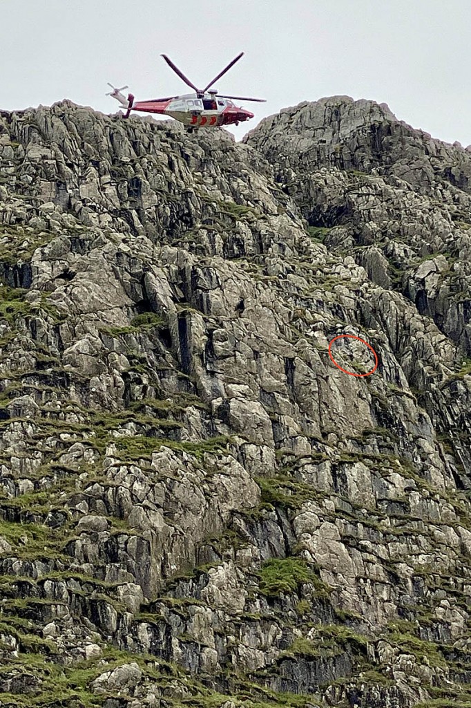 The Coastguard helicopter at Great End, with the cragfast walker, centre right. Photo: Keswick MRT