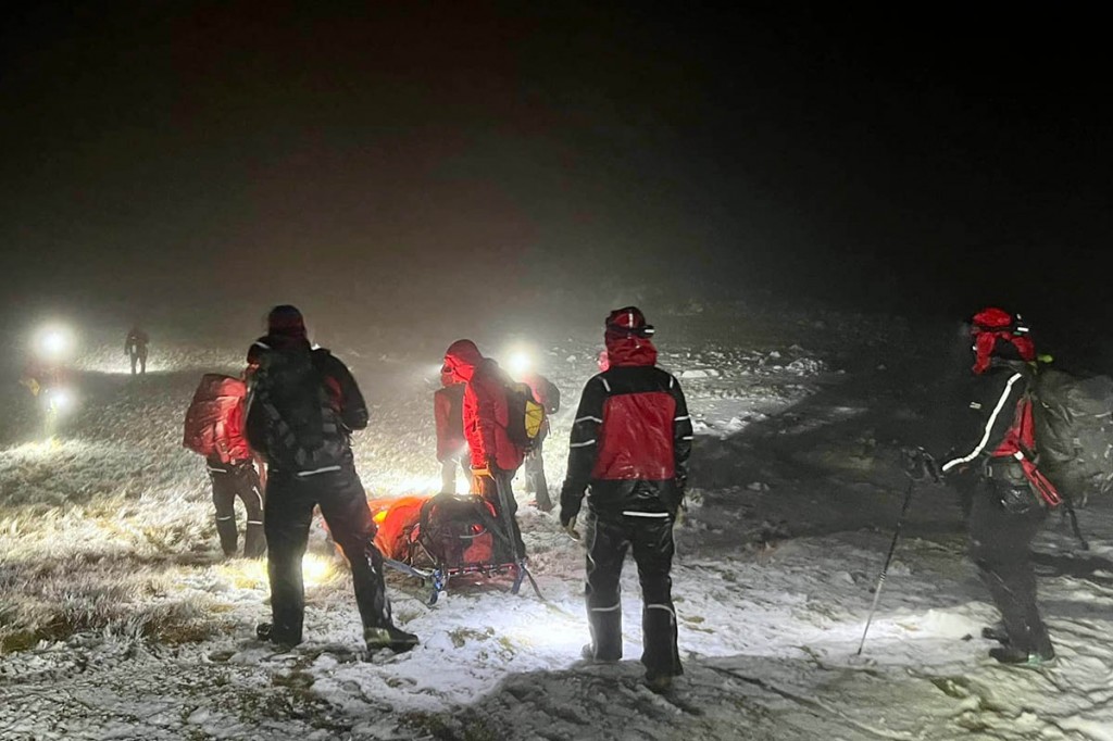 Rescuers with the Green Gable casualty. Photo: Keswick MRT