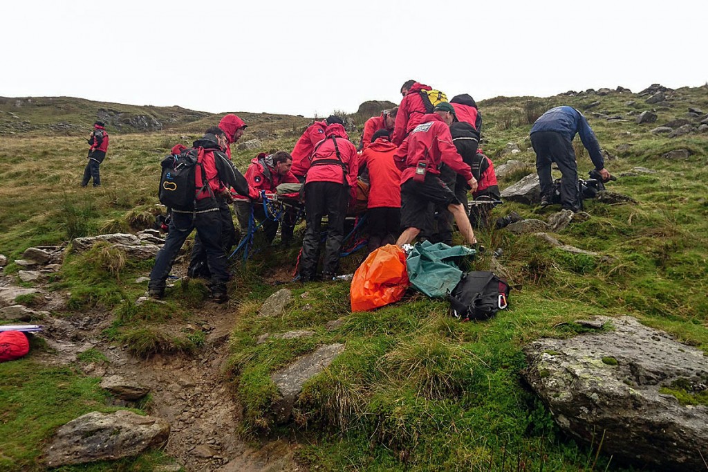 Rescuers treat the injured walker on Greenup Edge, between Borrowdale and Easedale. Photo: Keswick MRT