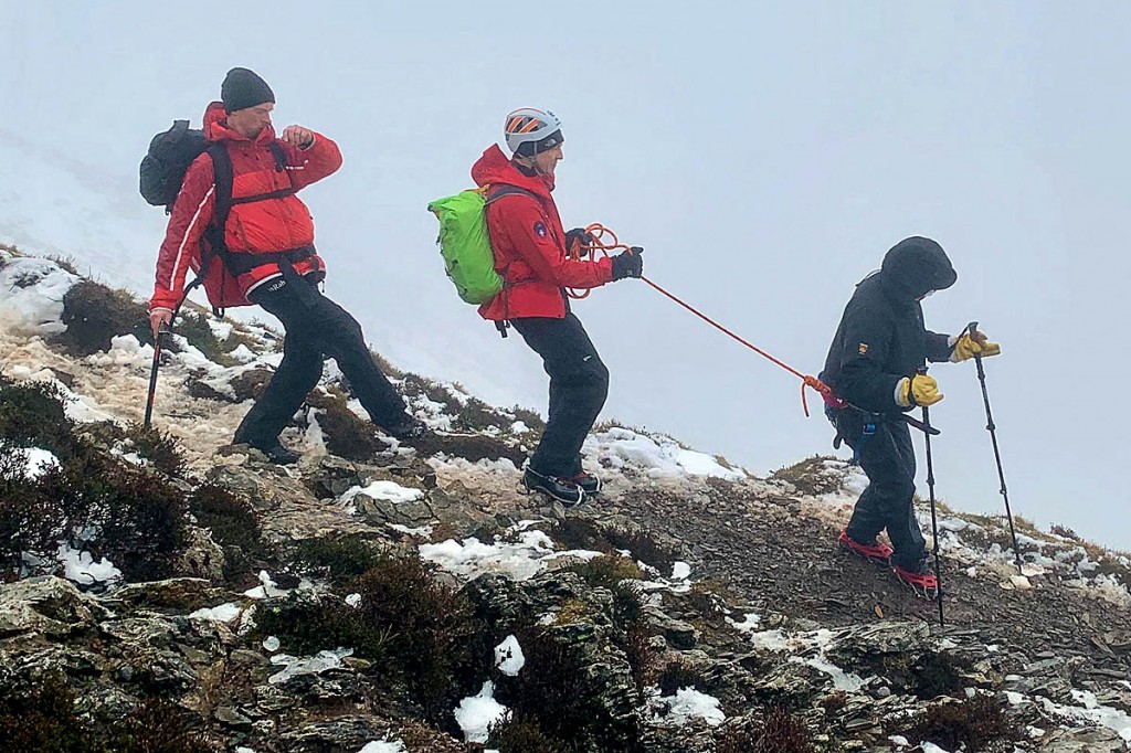 Rescuers short-rope one of the campers from the mountain. Photo: Keswick MRT Rescuers short-rope one of the campers from the mountain. Photo: Keswick MRT