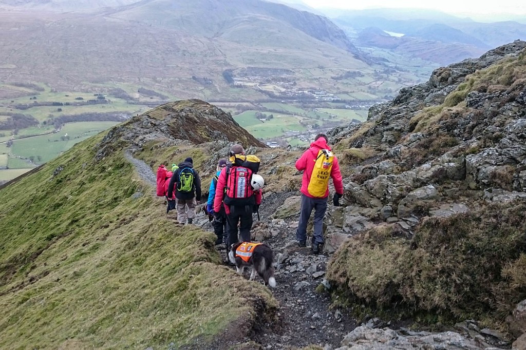 Rescuers lead the walkers to safety down Hall's Fell Ridge. Photo: Keswick MRT