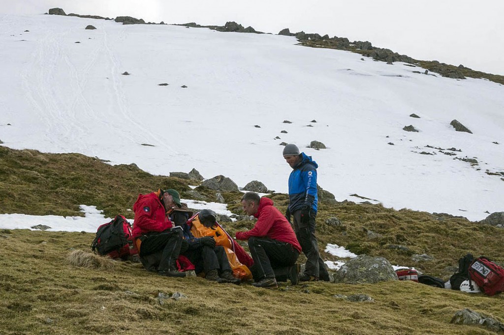 Rescuers with the injured walkers at the scene. Photo: Keswick MRT