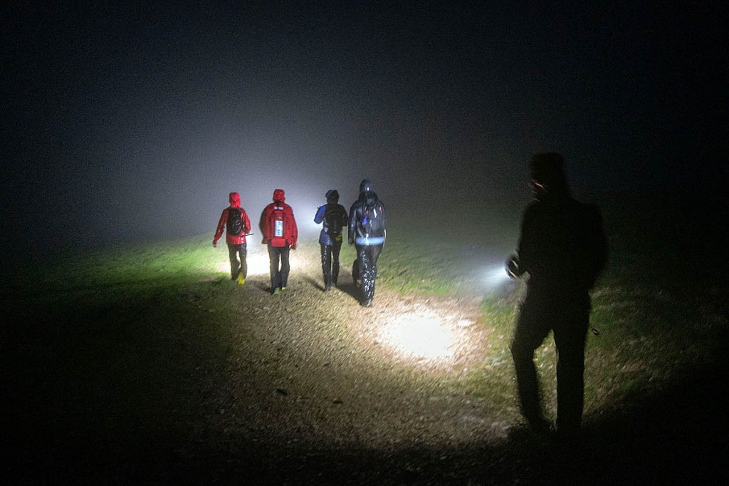 Rescuers accompany the walkers from the fell. Photo: Keswick MRT