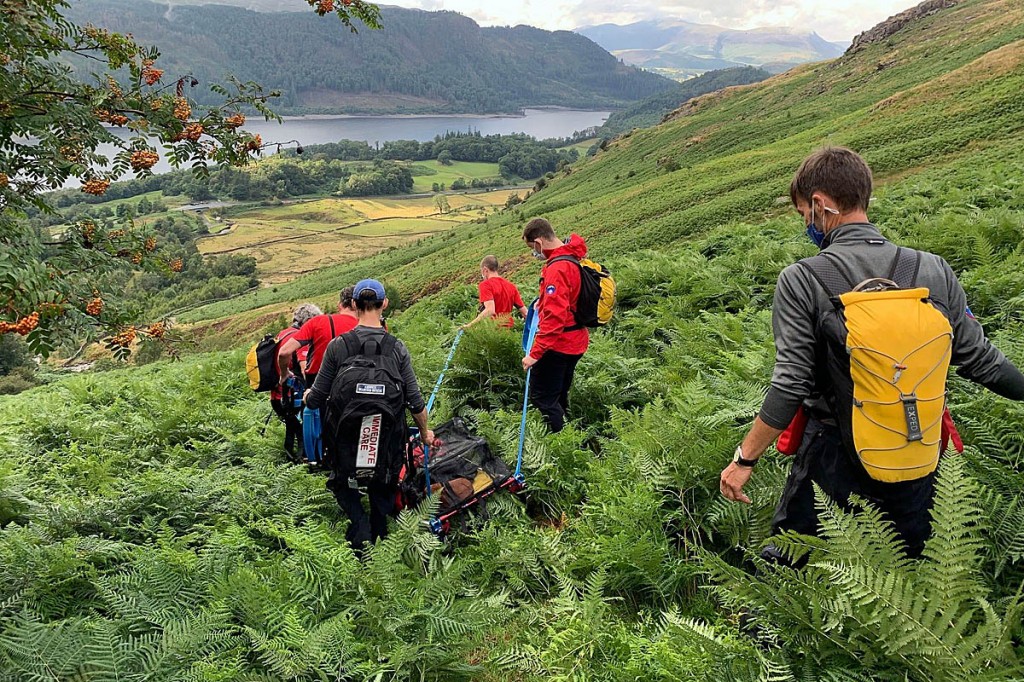 Rescuers stretcher the walker down to Swirls. Photo: Keswick MRT Rescuers stretcher the walker down to Swirls. Photo: Keswick MRT
