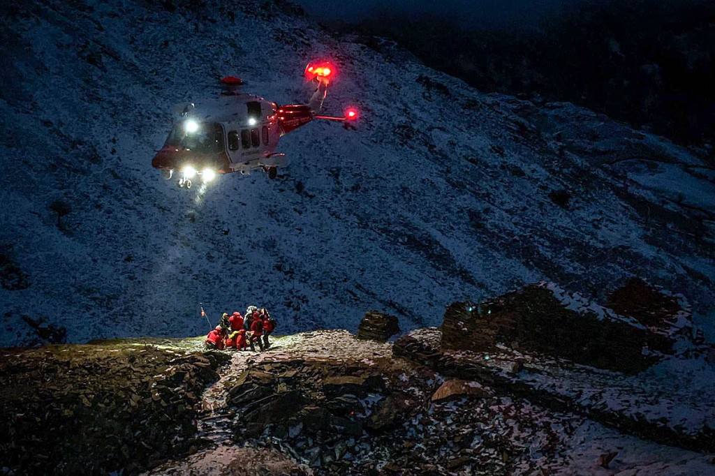 Rescuers and the Coastguard helicopter at the scene. Photo: Keswick MRT