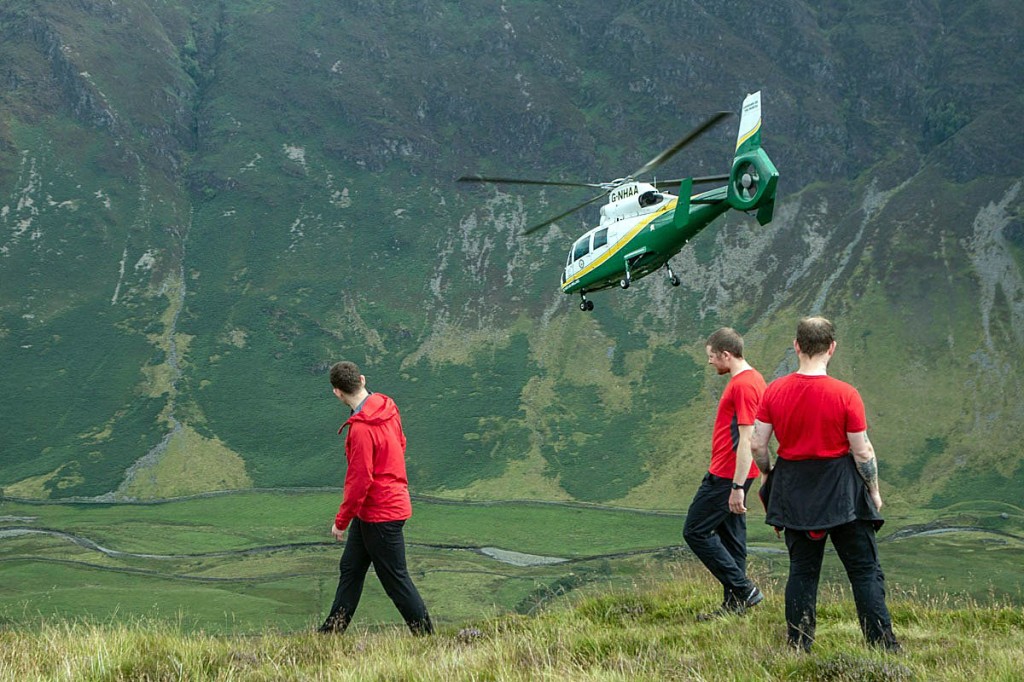 Rescuers and the air ambulance at the scene. Photo: Keswick MRT