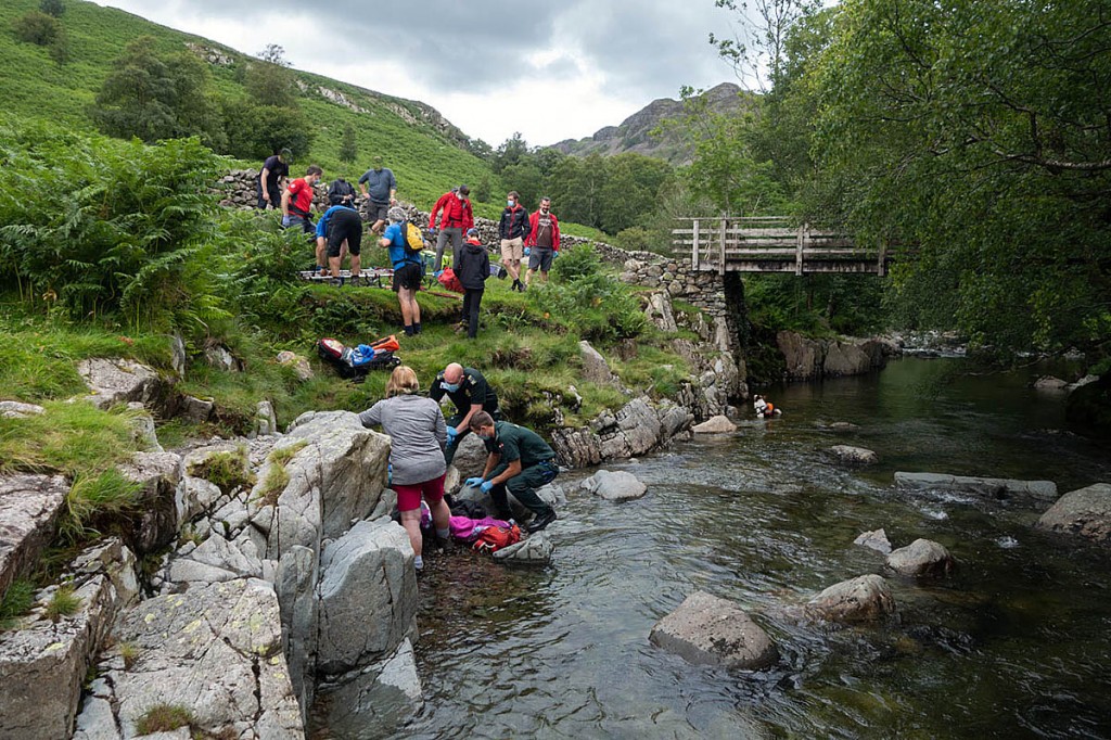 Rescuers deal with the injured teen in Langstrath. Photo: Keswick MRT Rescuers deal with the injured teen in Langstrath. Photo: Keswick MRT