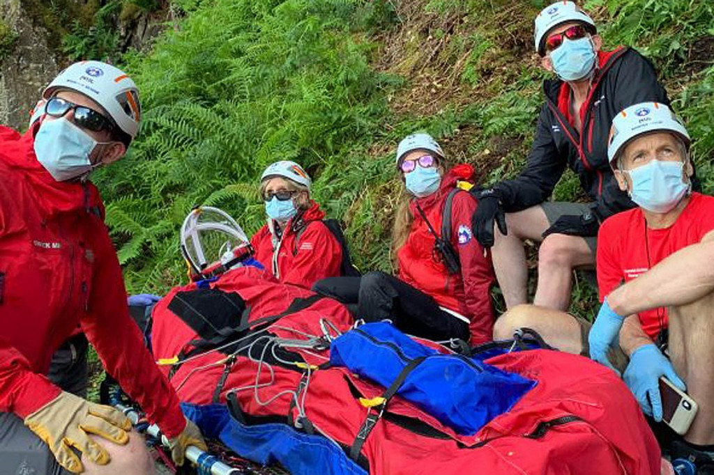 Team members with the casualty on the flanks of Broad Haystack. Photo: Keswick MRT Team members with the casualty on the flanks of Broad Haystack. Photo: Keswick MRT