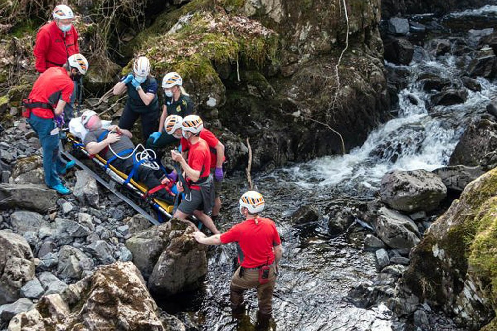 The injured man is stretchered from the gill. Photo: Keswick MRT The injured man is stretchered from the gill. Photo: Keswick MRT