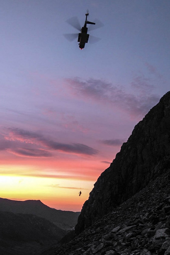 The climber is winched into the Coastguard helicopter. Photo: Keswick MRT The climber is winched into the Coastguard helicopter. Photo: Keswick MRT