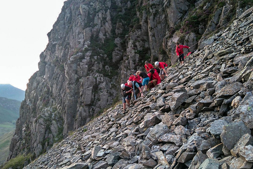 Team members at the boulder field with the fallen climber. Photo: Keswick MRT Team members at the boulder field with the fallen climber. Photo: Keswick MRT