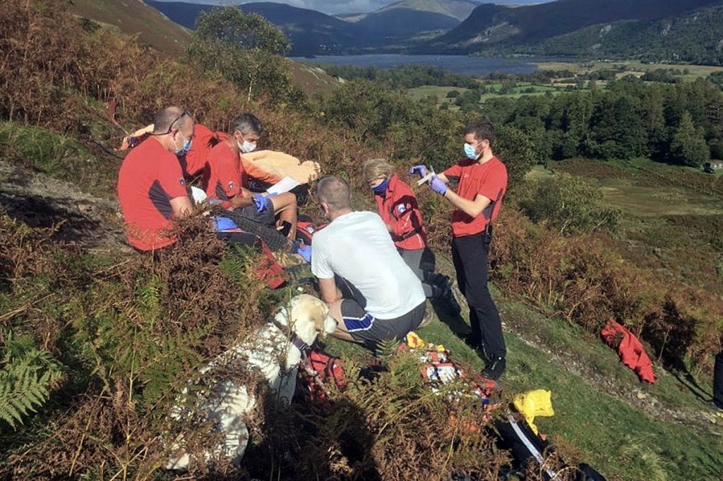 Rescuers tend to the injured walker above Borrowdale. Photo: Keswick MRT