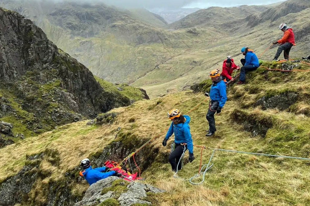 Rescuers haul the stretcher carrying the injured walker from Piers Gill. Photo: Keswick MRT
