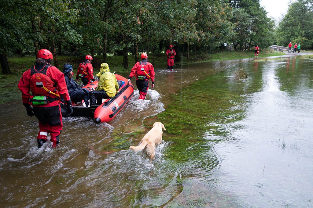 Rescuers used their boat to get the couple across the worst flooded areas. Photo: Keswick MRT