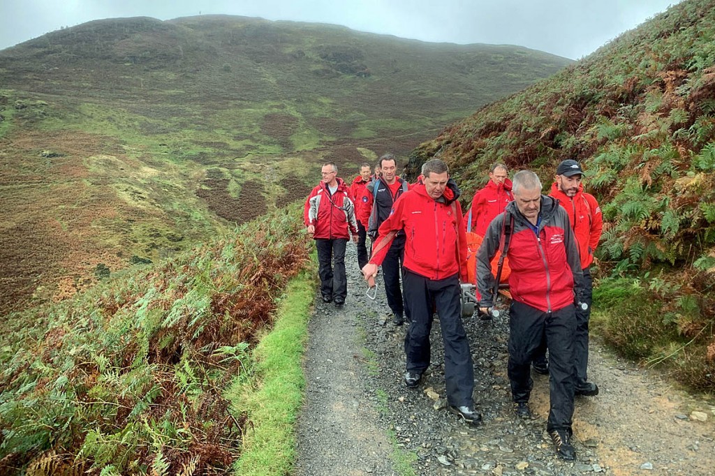 Team members stretcher the man from Stonycroft Gill. Photo: Keswick MRT