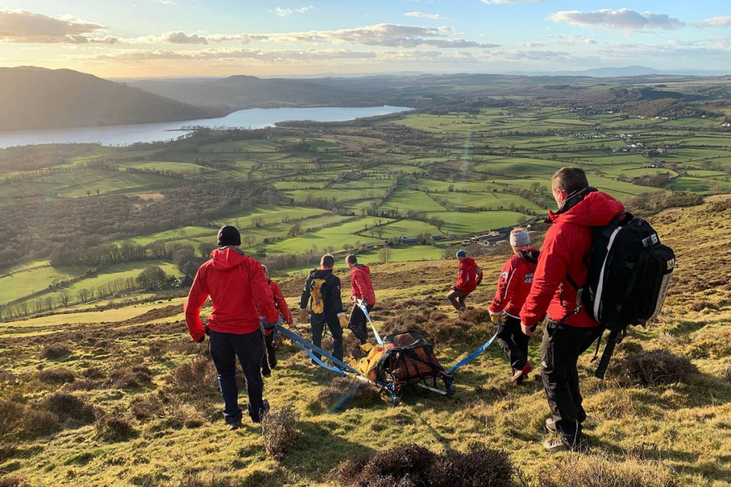 Rescuers stretcher the walker from Ullock Pike. Photo: Keswick MRT