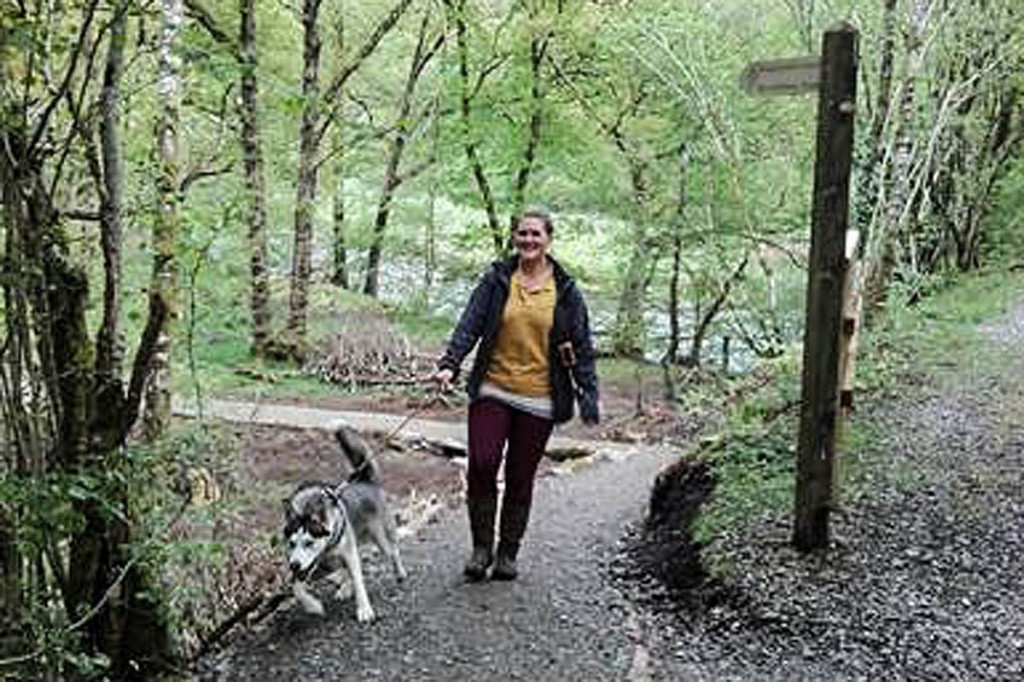 Emma Atkinson from nearby Low Briery caravan park and dog Togo on the newly created Keswick to Threlkeld path's diversion