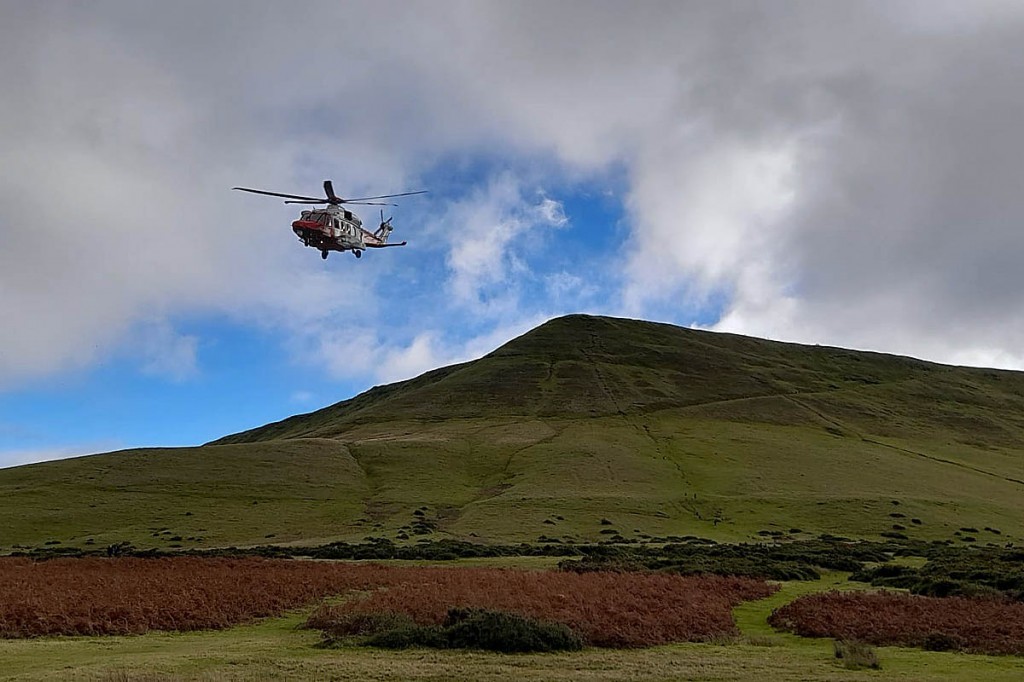 The Coastguard helicopter at the scene on Hay Bluff. Photo: Longtown MRT