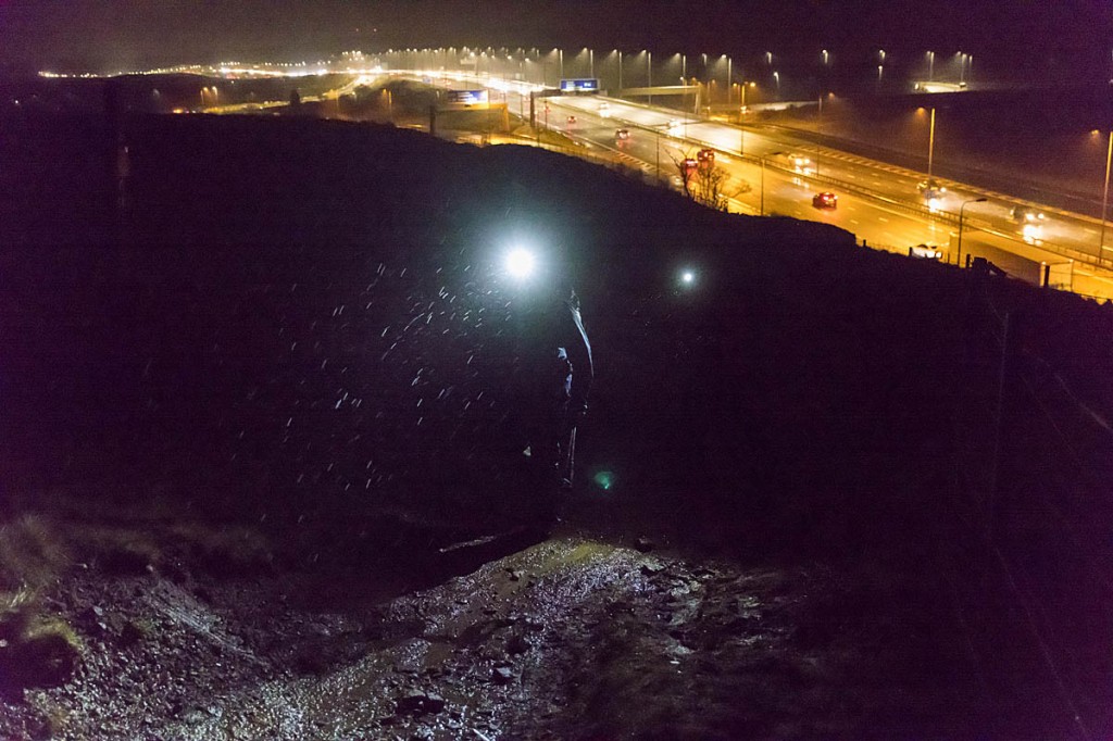 Runners head north after crossing the M62 motorway at night. Photo: Bob Smith/grough
