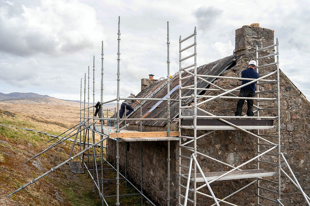 Volunteers work on the Leacraithnaich bothy. Photo: Craig Marshall Volunteers work on the Leacraithnaich bothy. Photo: Craig Marshall