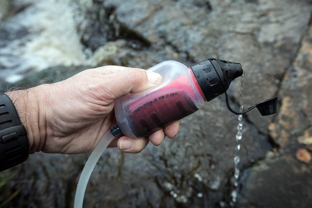 The Trailshot is easy to use: dangle the hose in the water and squeeze the bulb. Photo: Bob Smith/grough