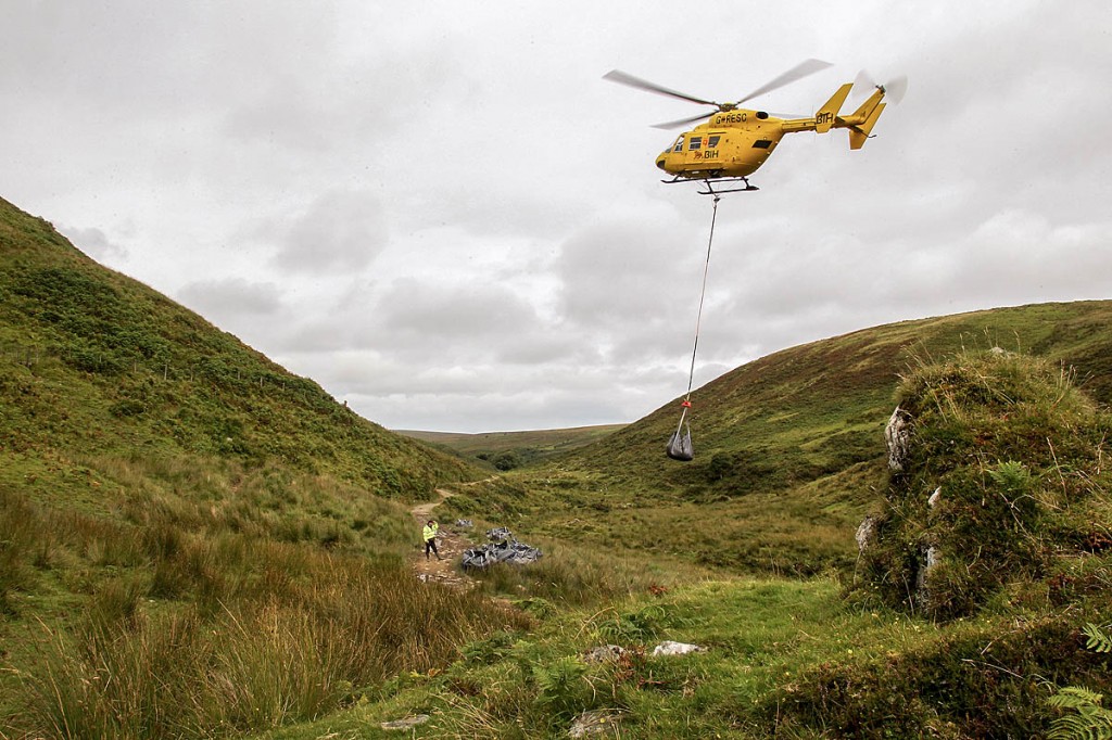 A helicopter lifts stone to the site on Exmoor A helicopter lifts stone to the site on Exmoor